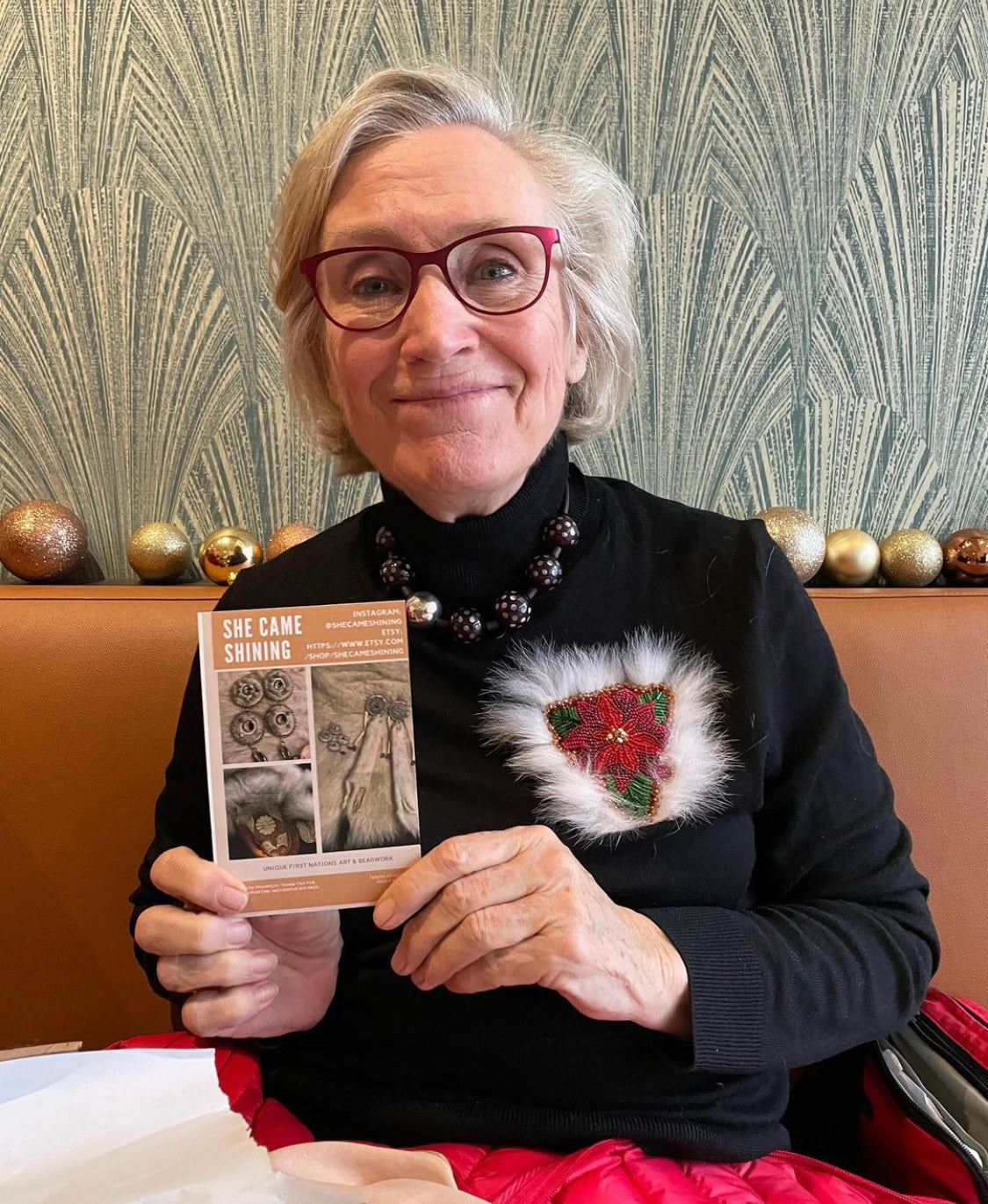 Minister Carolyn Bennett Custom Beaded Poinsettia with White Fox Fur